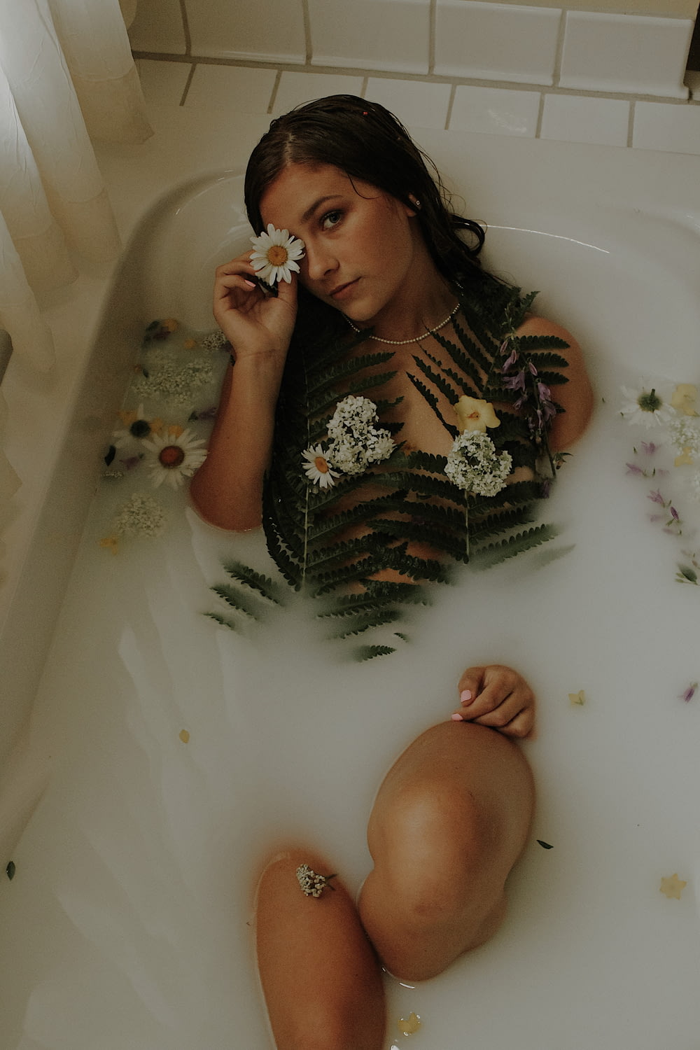 a person sitting in a bathtub