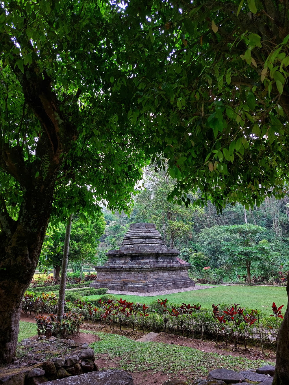 a stone structure in a park