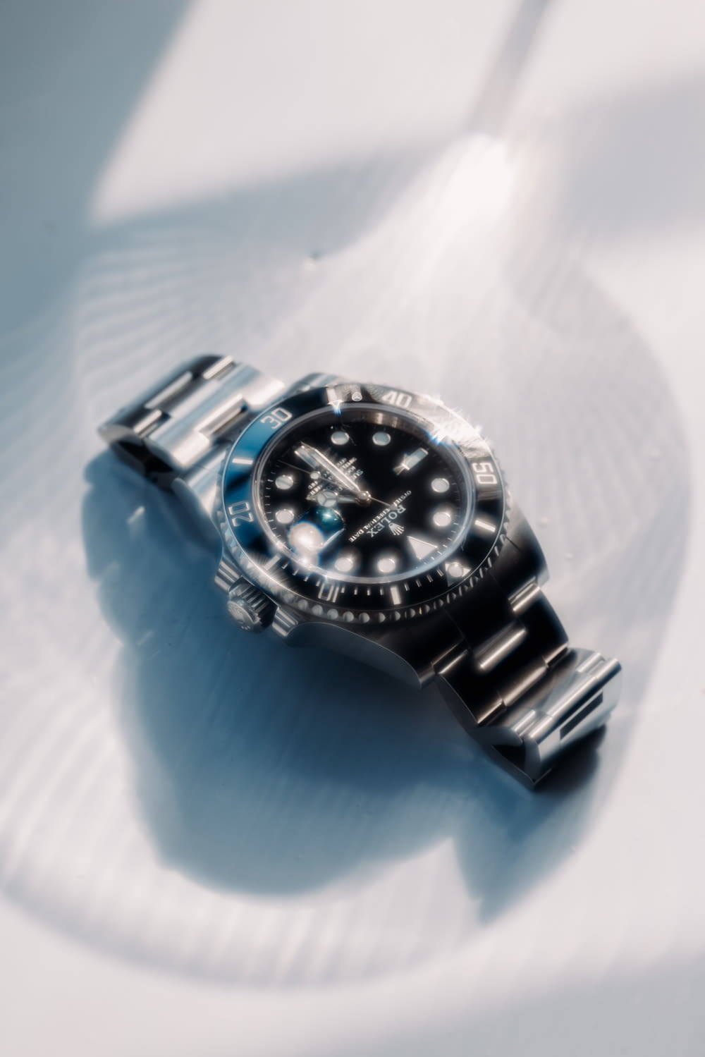 a watch on a blue surface