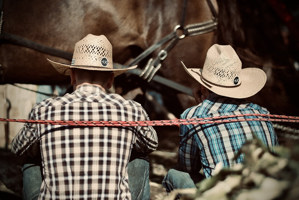 a few men wearing cowboy hats