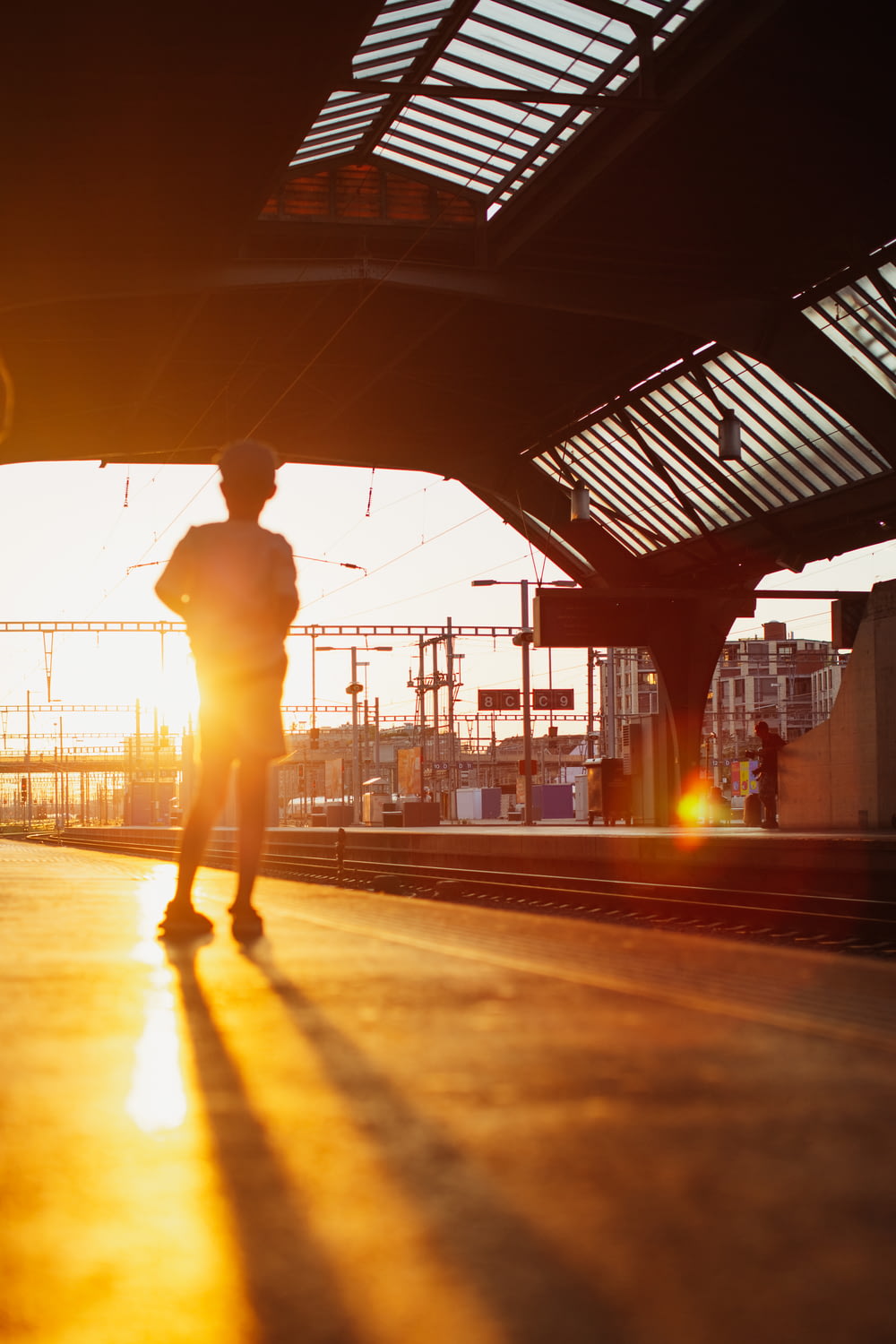a person walking on a train platform