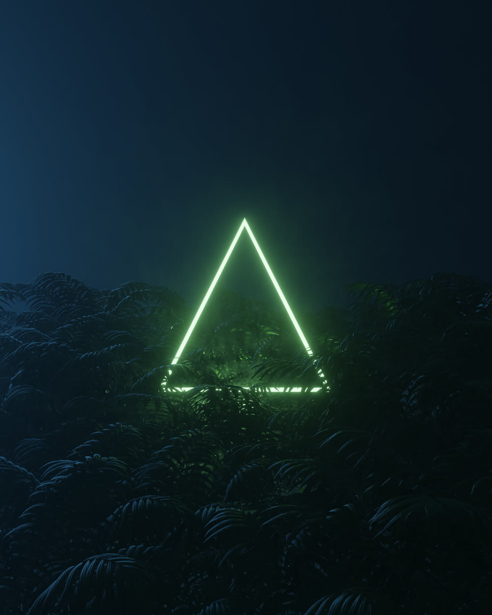a pyramid with lights at night