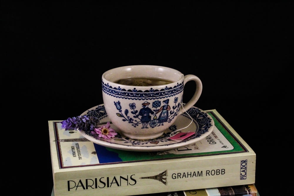 a cup of coffee on a book