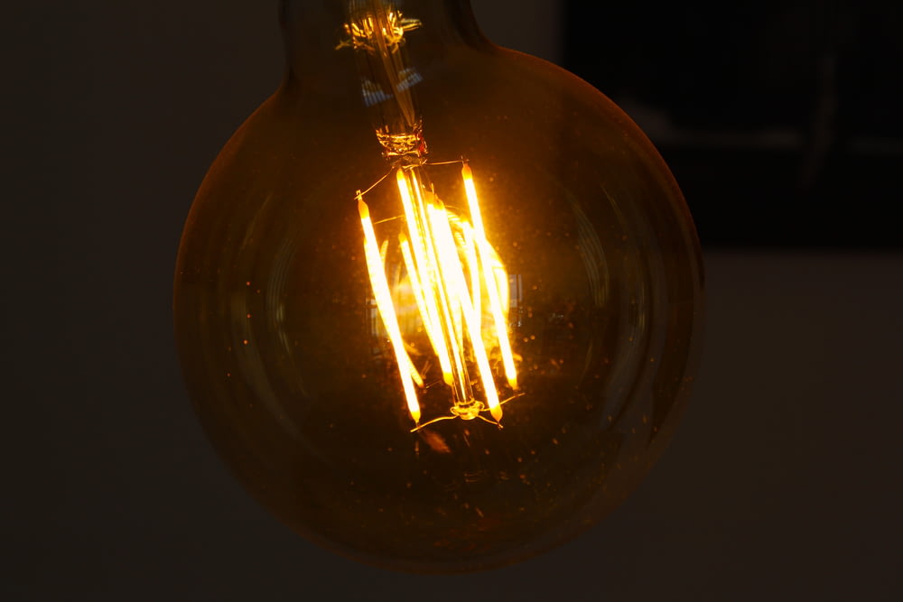 a light bulb with a flame
