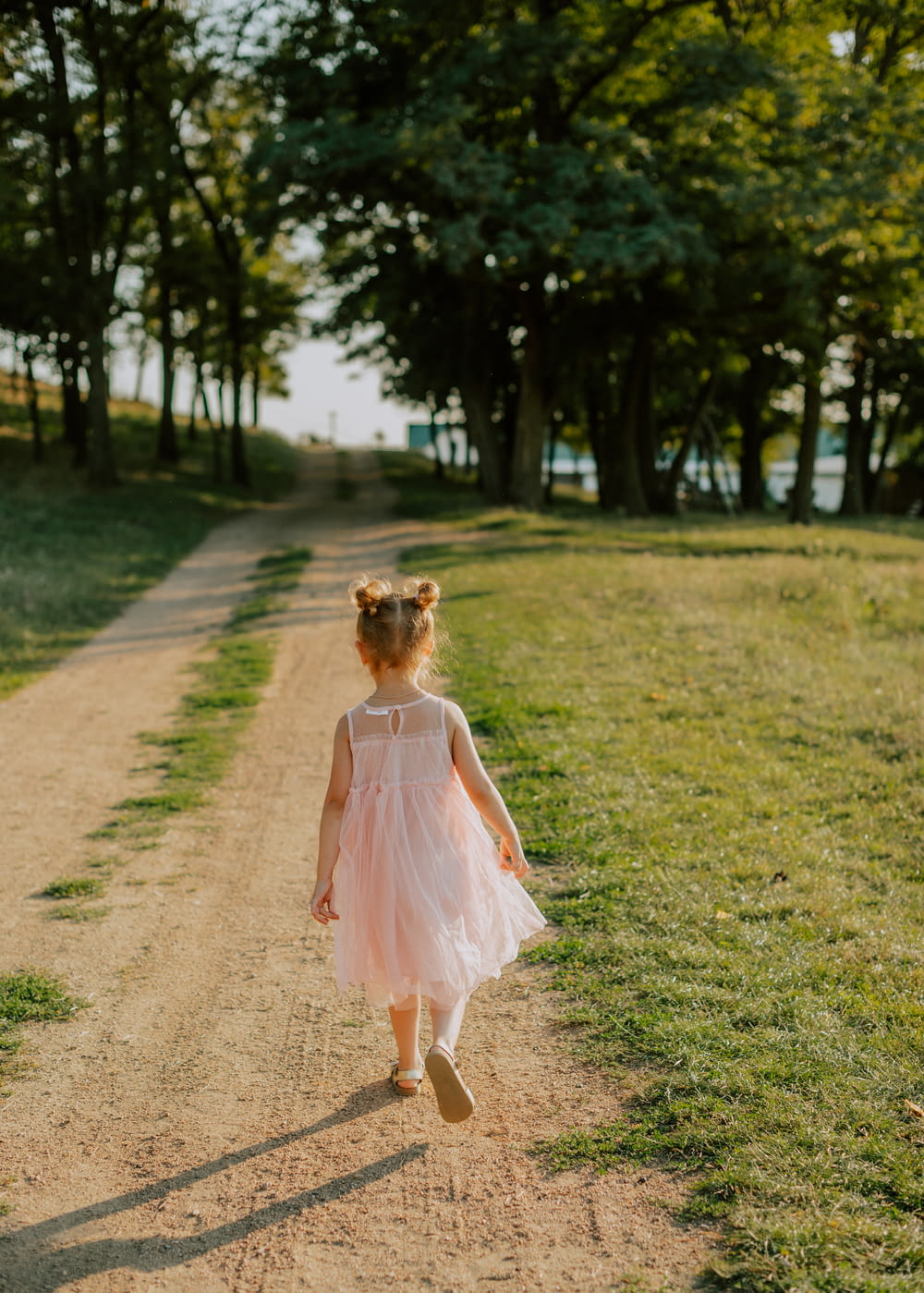 a girl walking on a path