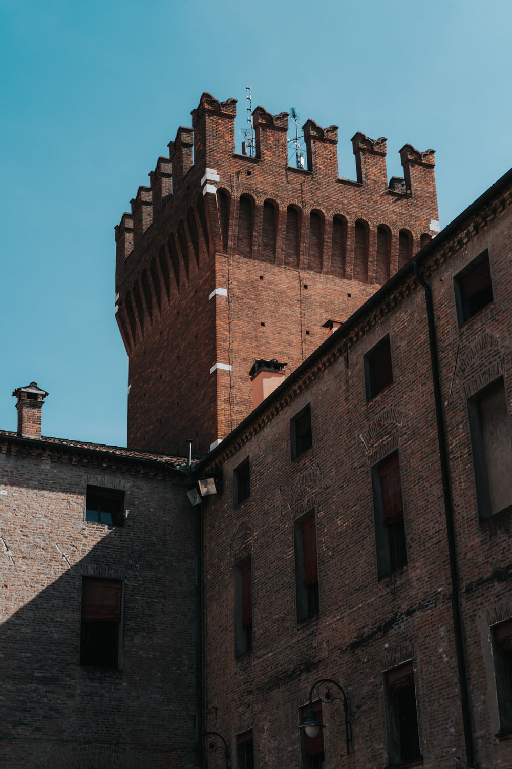 a brick building with a blue sky