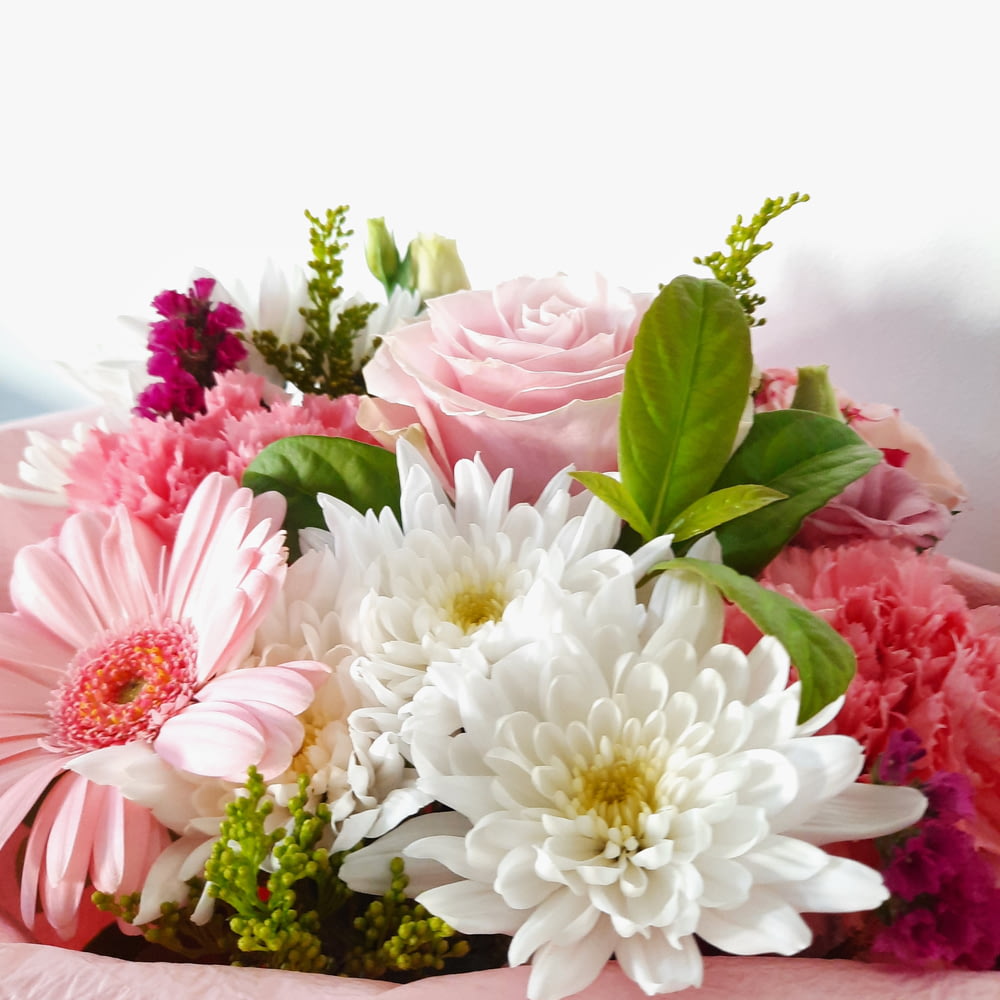a bouquet of pink and white flowers