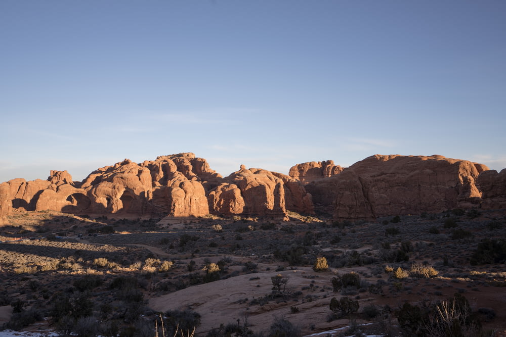 a desert landscape with a few large rocks