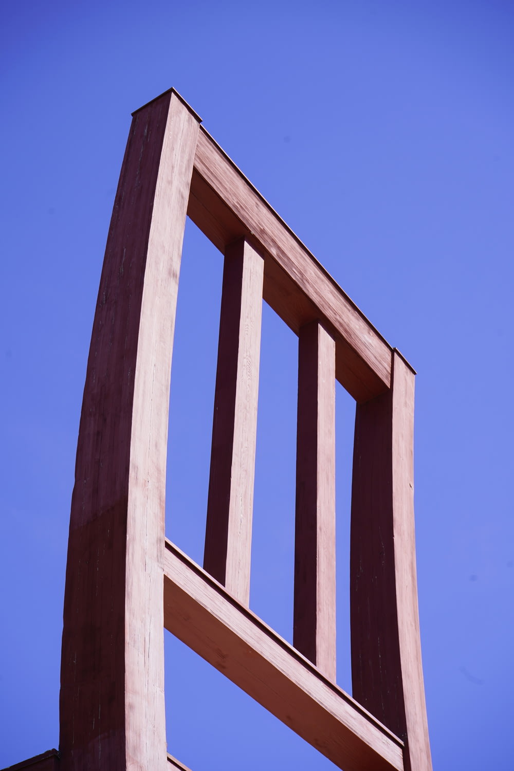 a wooden structure with a blue sky