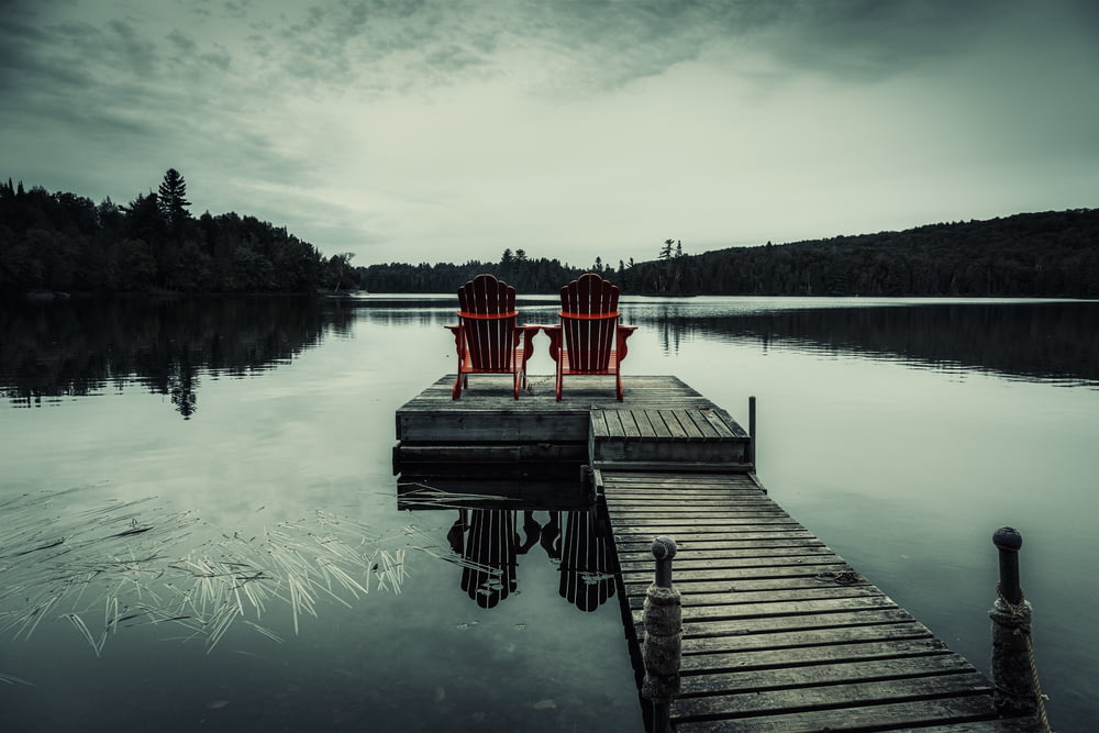 a dock with chairs on it