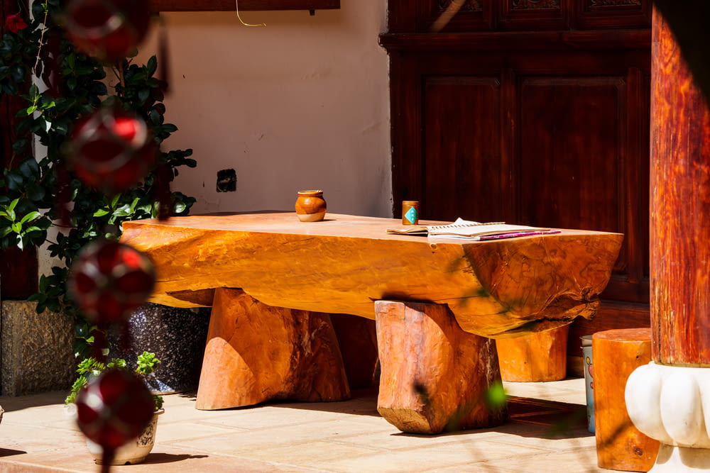 a wooden table with a tree and ornaments