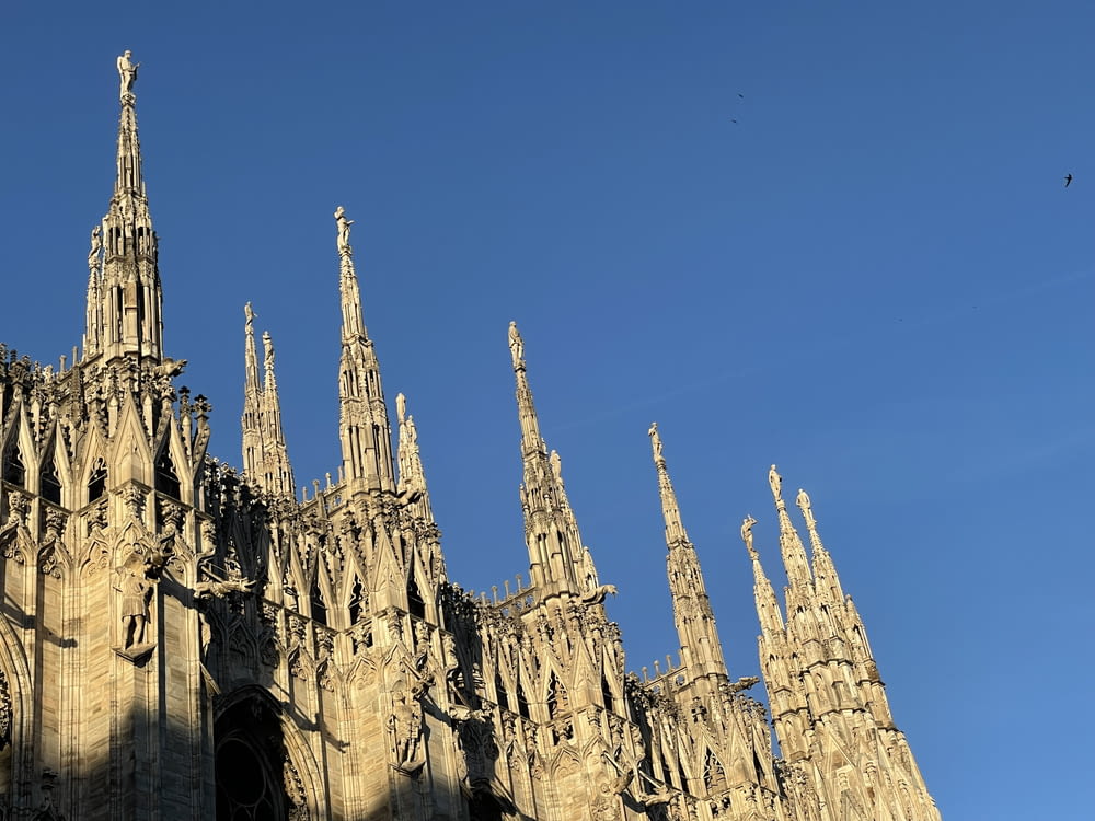 a large stone castle with Milan Cathedral in the background