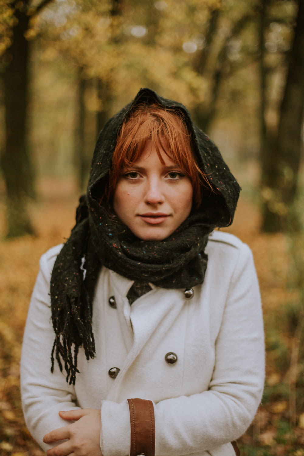 a woman with red hair and a scarf on her head