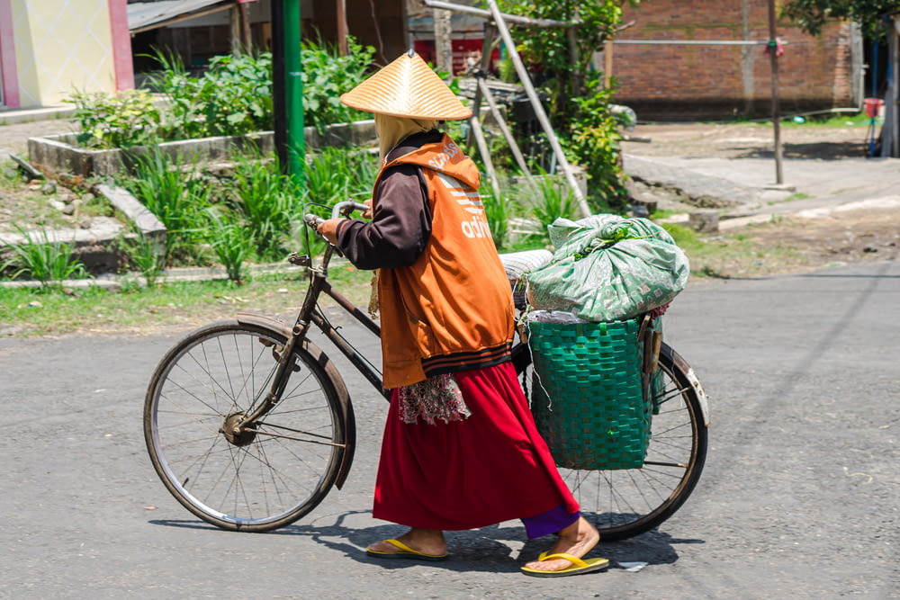 a person carrying a basket of vegetables