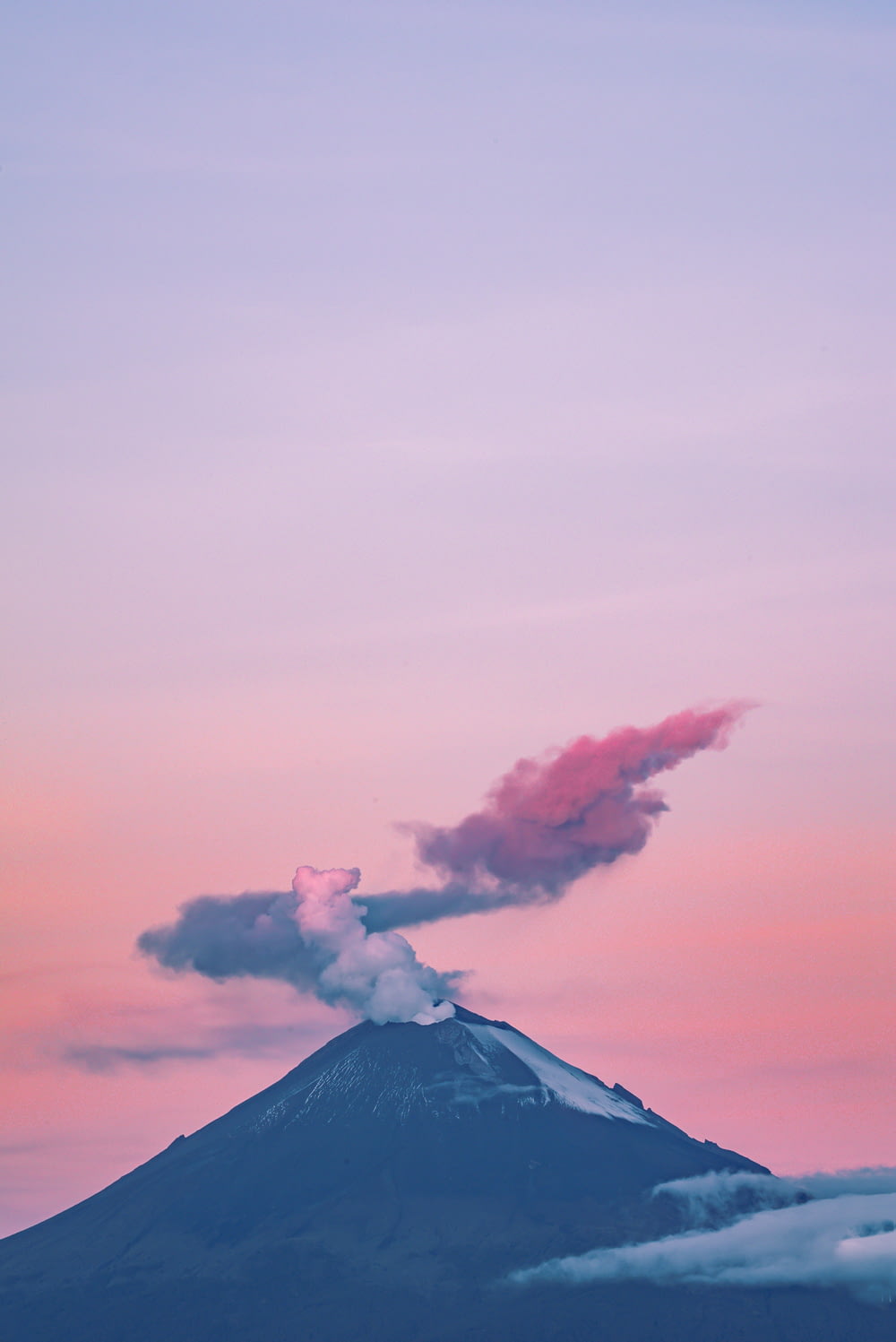 a mountain with smoke coming out of it