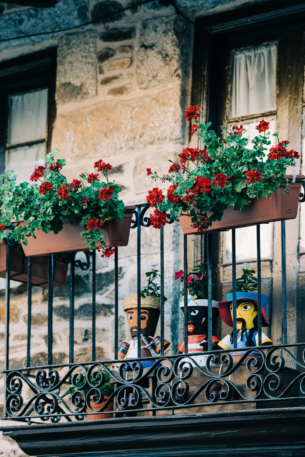 a balcony with potted plants