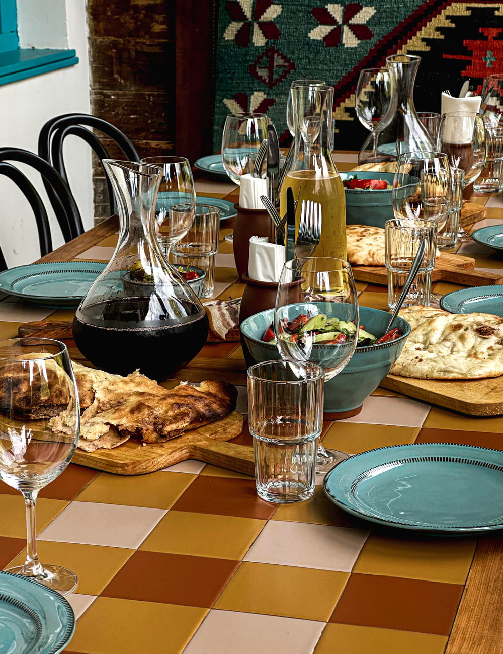 a table with many dishes and glasses on it