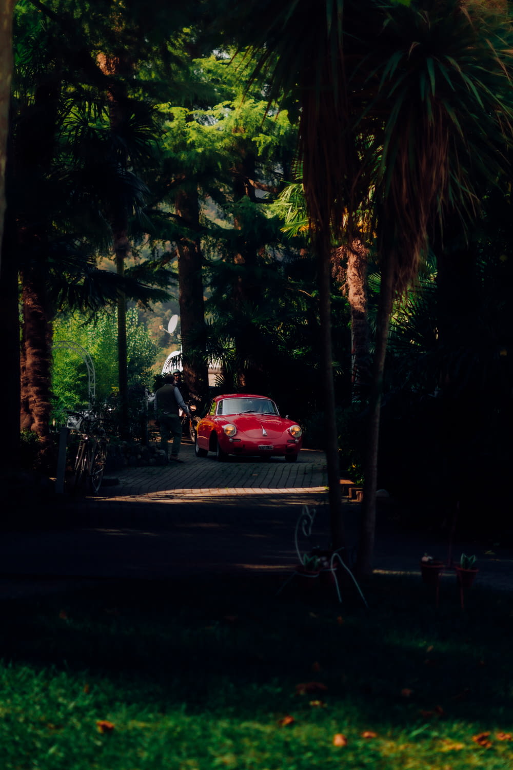 a red car parked in a driveway
