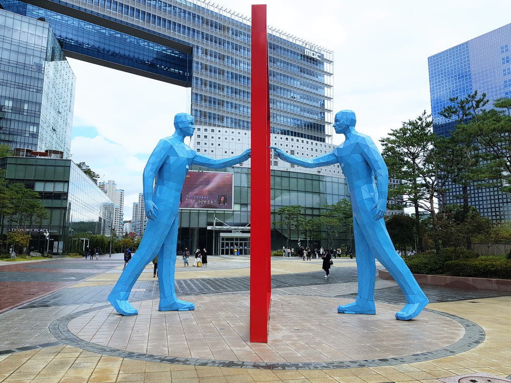 a group of blue statues