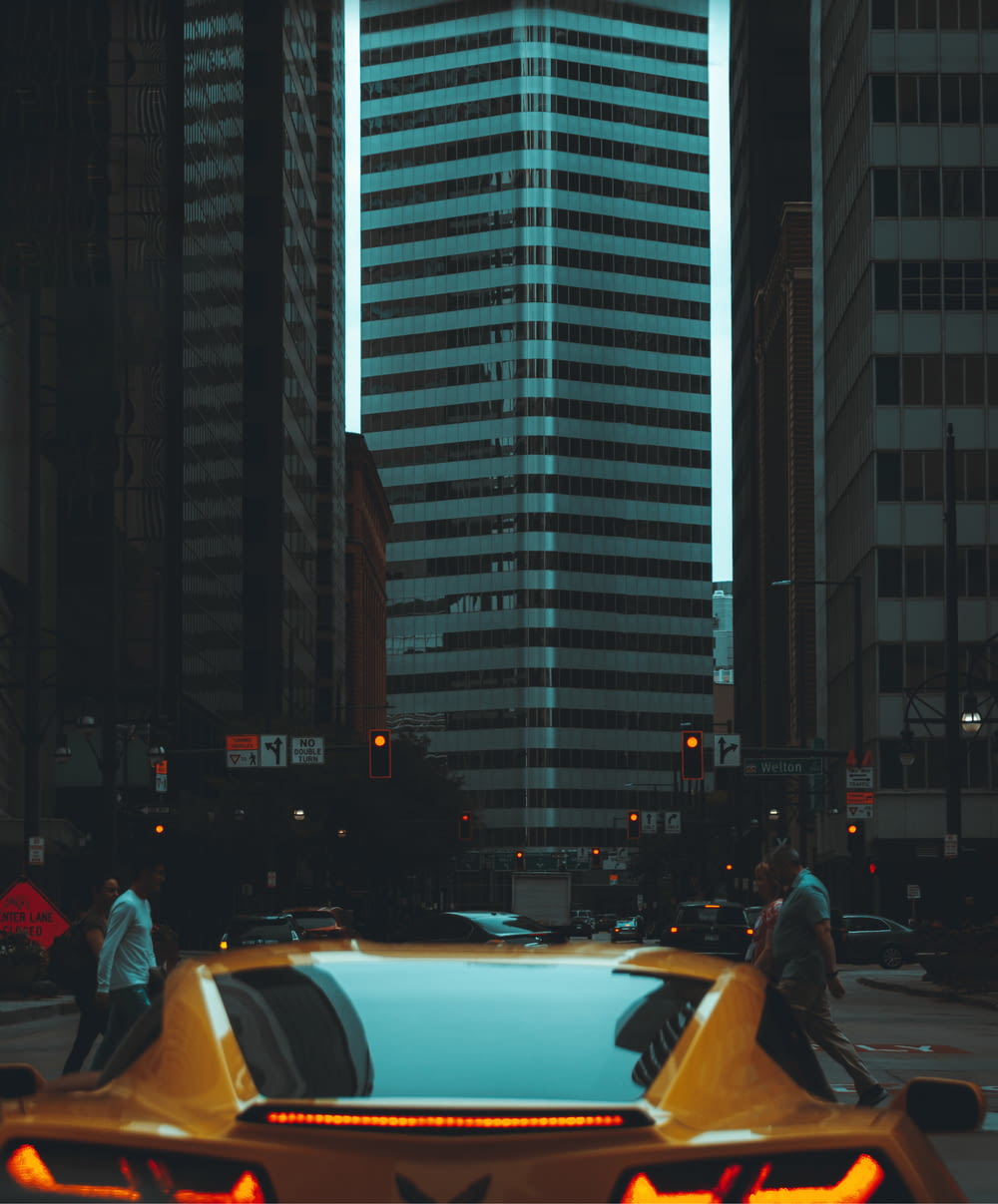 a yellow taxi cab in a city