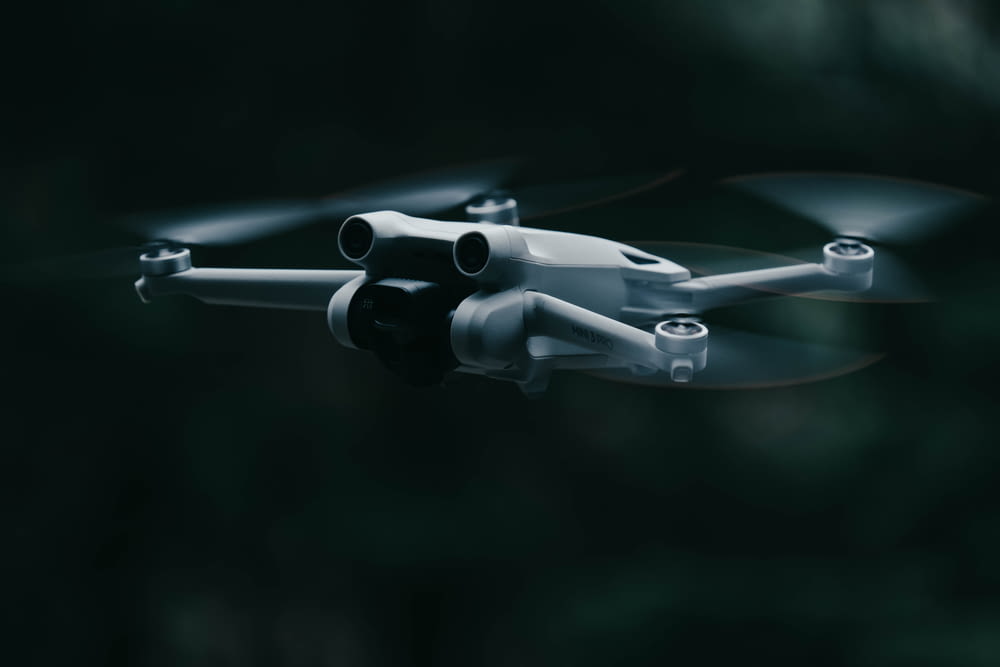 a white drone with a black background