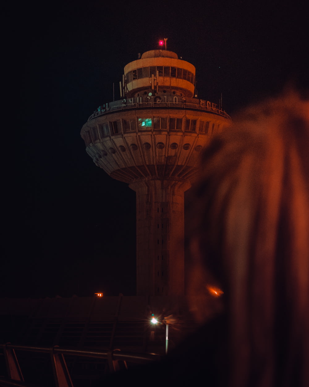 a large tower with lights at night