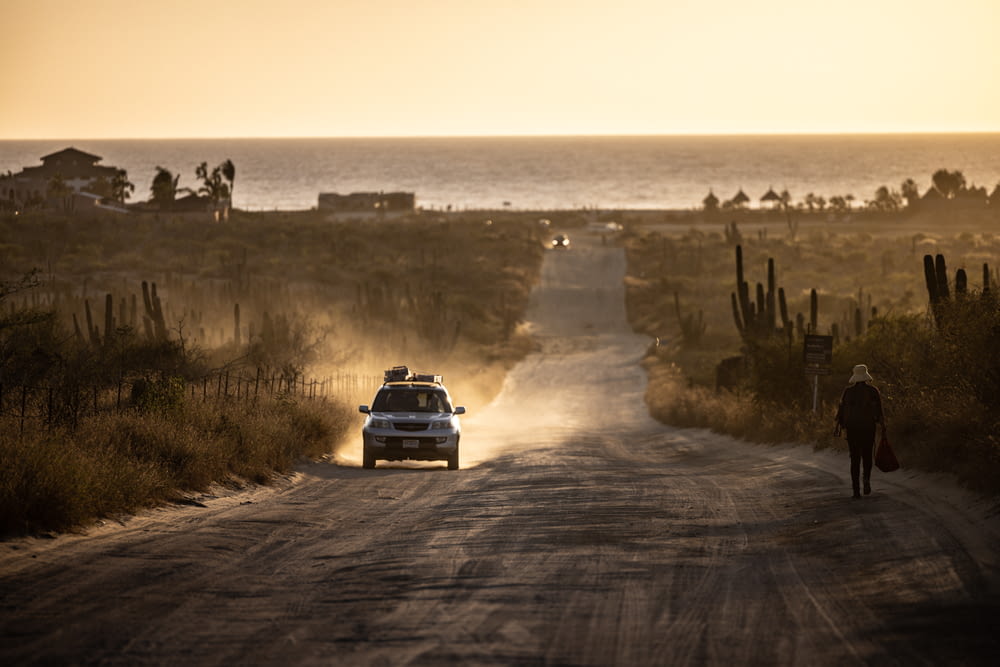 a car driving on a dirt road