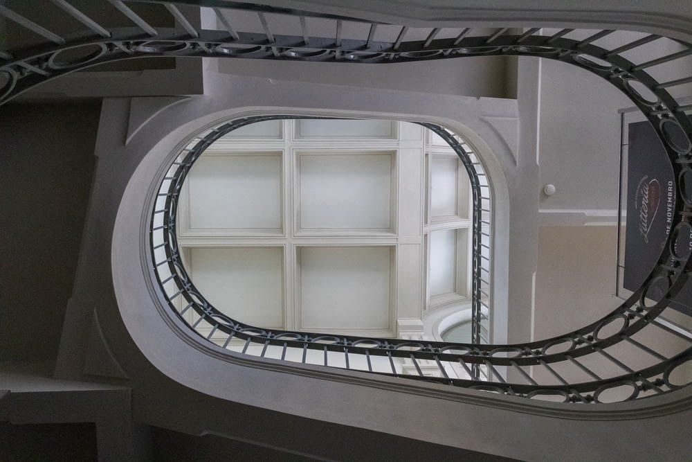 a circular staircase with a railing