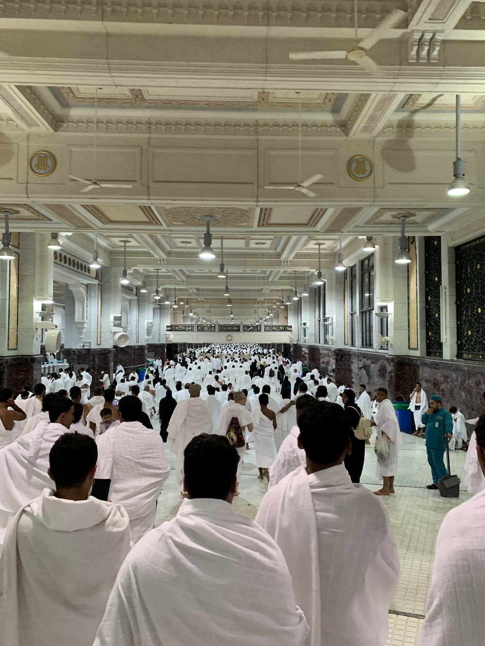 a group of people in white robes