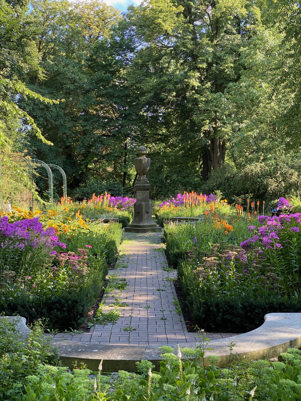 a stone pathway through a garden