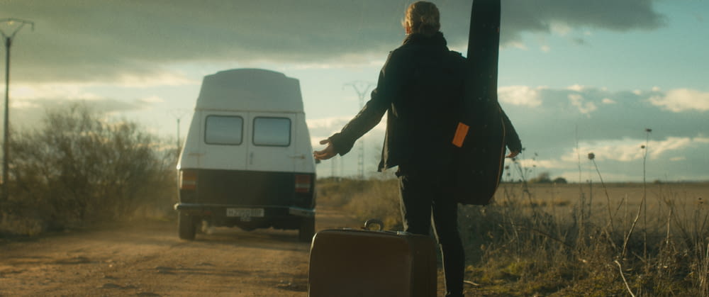 a person walking with a suitcase