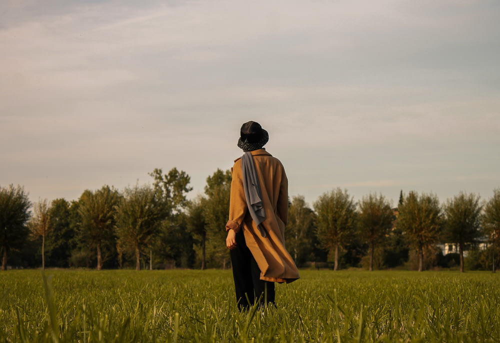 a man walking through a field