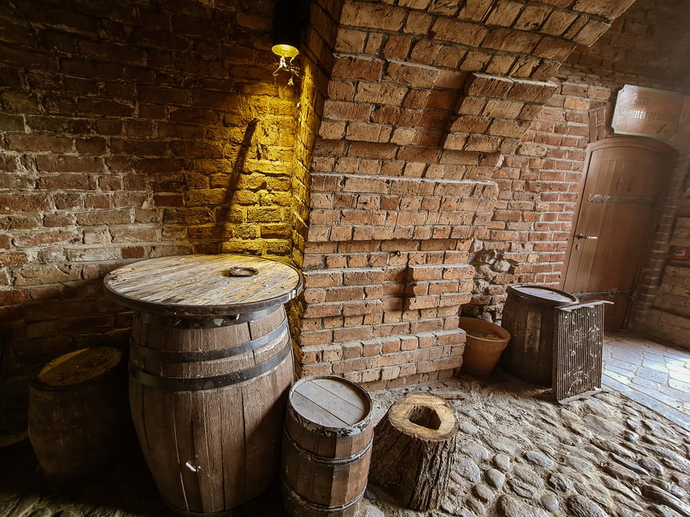 a brick wall with barrels