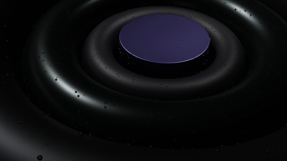 a black circle with a purple center