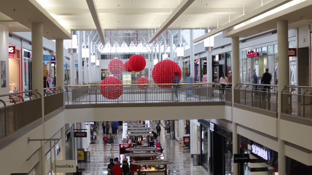 a shopping mall with red balls