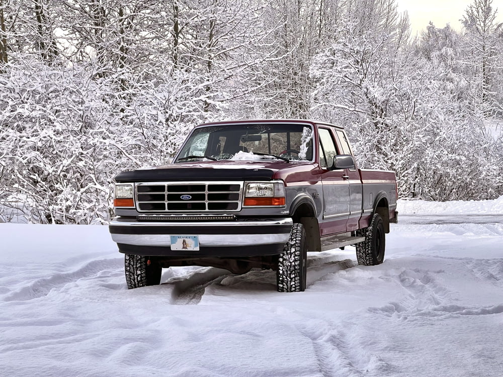 a truck driving through the snow