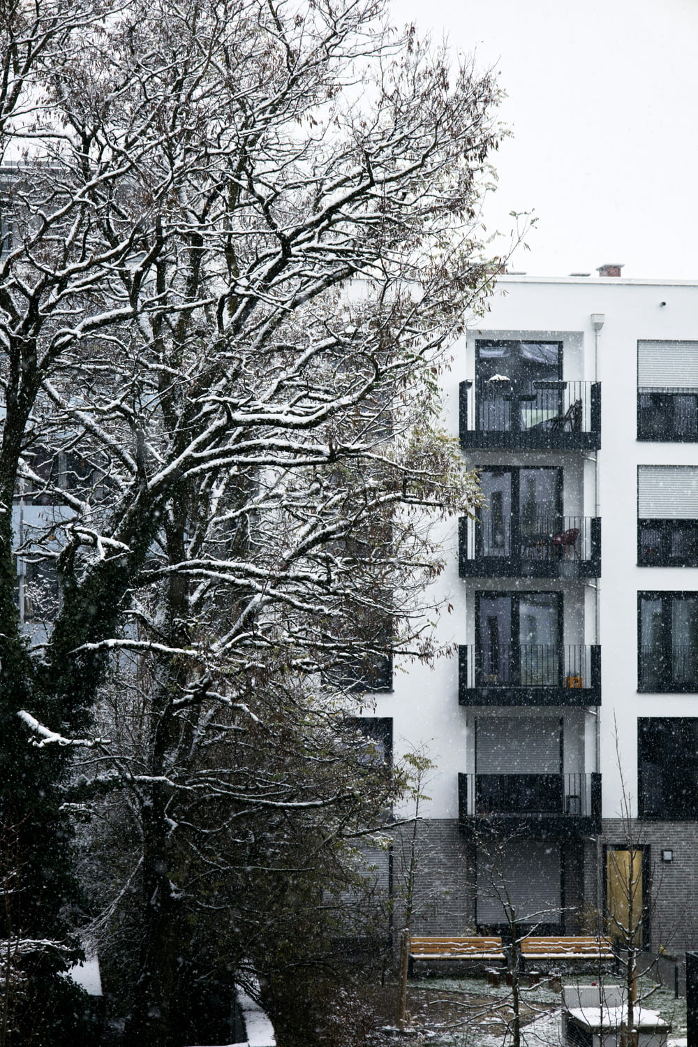 a building with balconies and balconies covered in snow