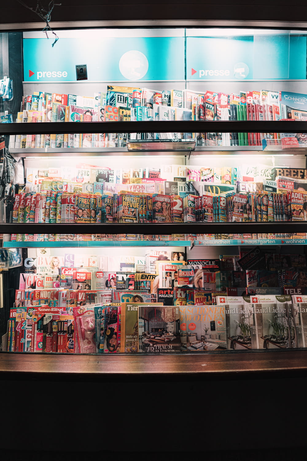 a large display of magazines in a store
