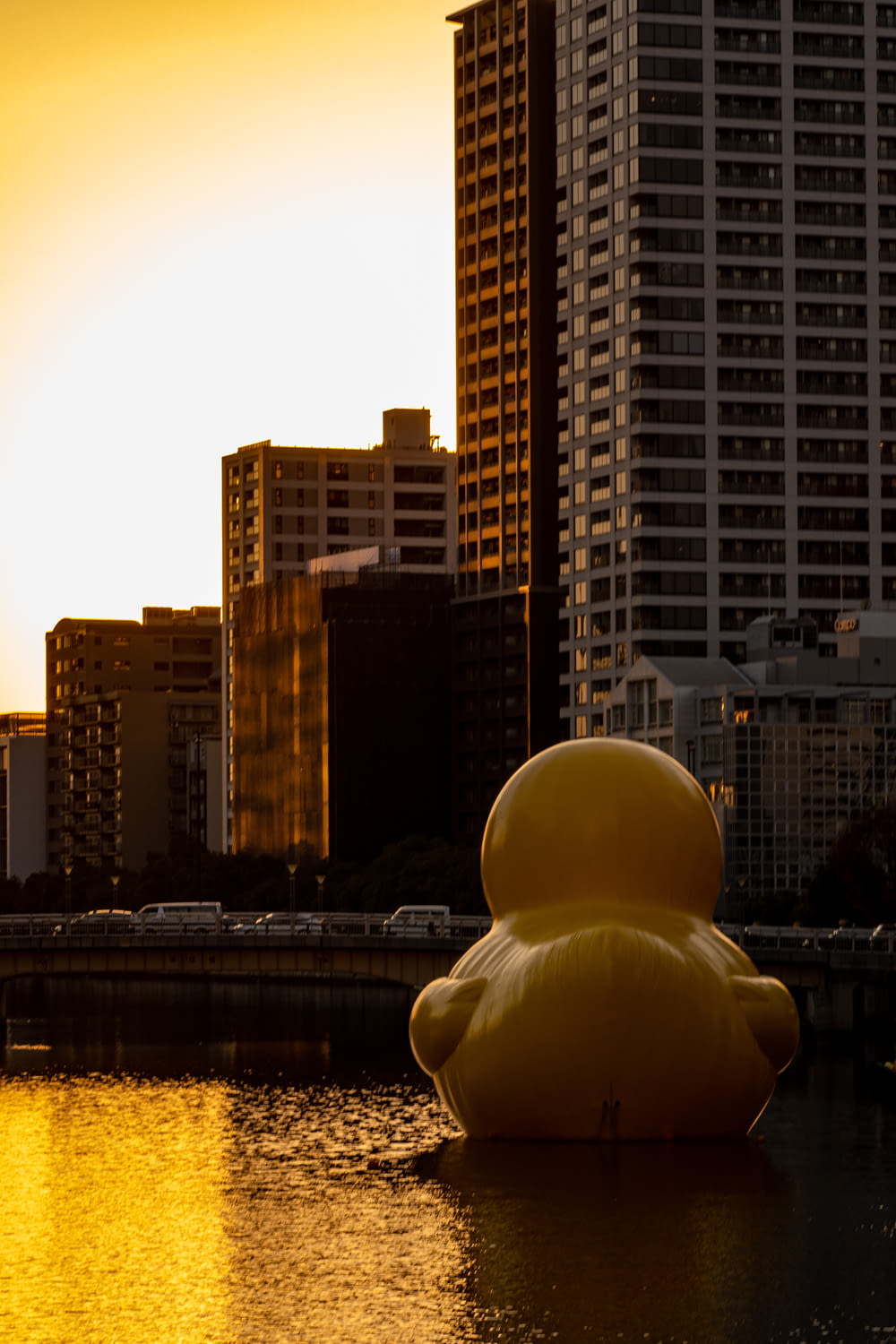 a large inflatable duck floating in a body of water