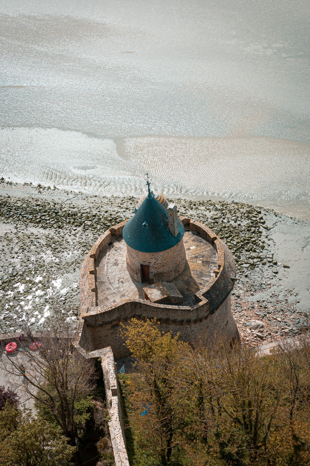 an aerial view of a tower on a beach