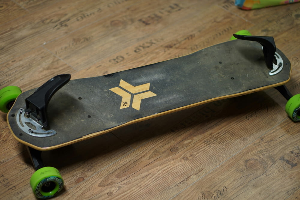 a skateboard sitting on top of a wooden floor