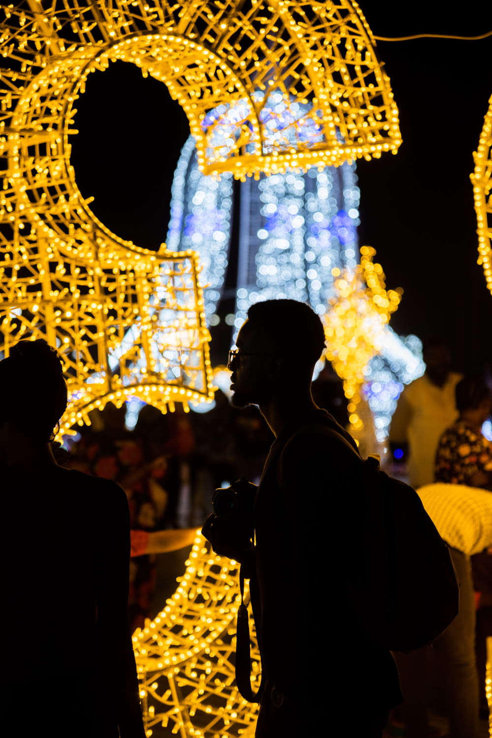 a man is standing in front of a display of lights