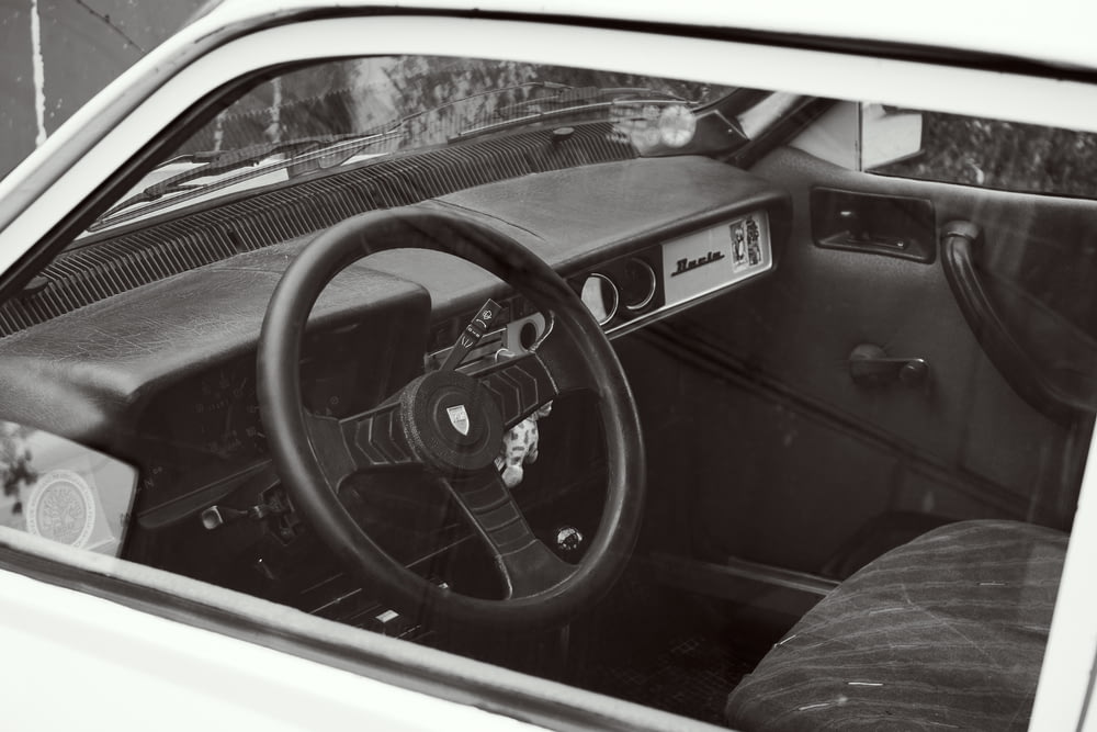 a black and white photo of a car dashboard
