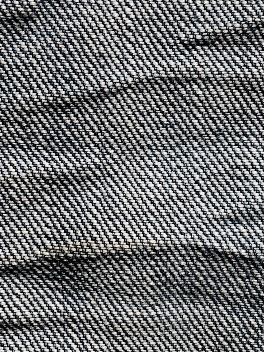a close up of a blue and white checkered fabric
