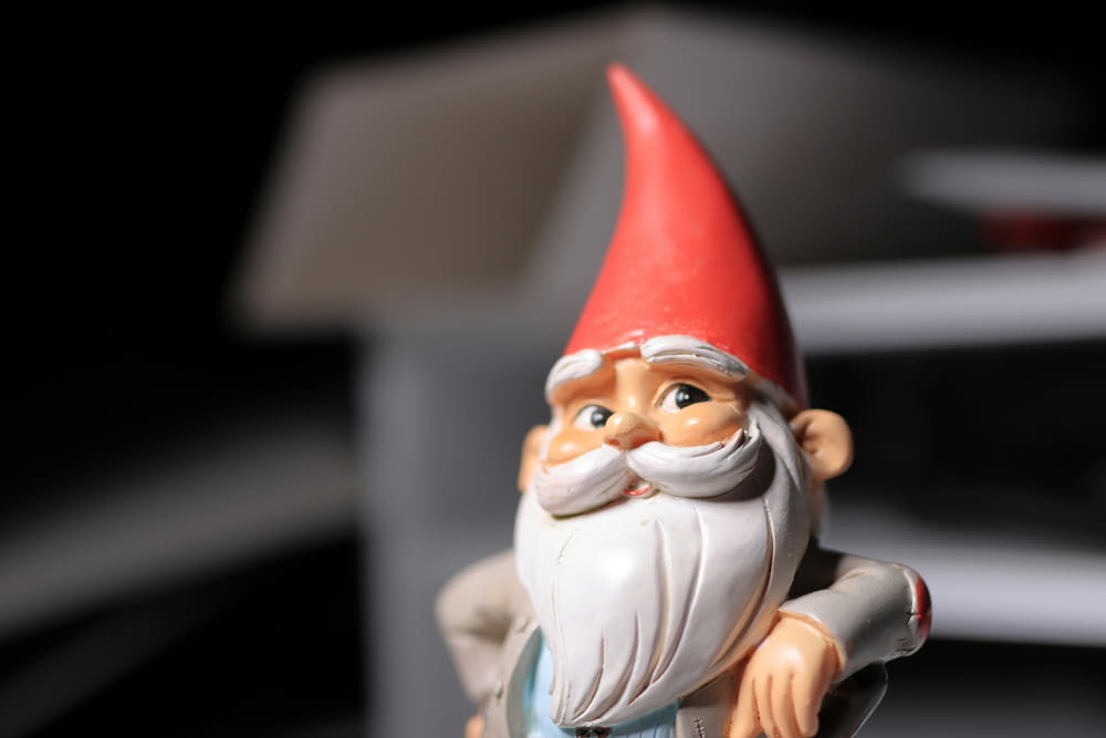 a gnome figurine sitting on top of a table