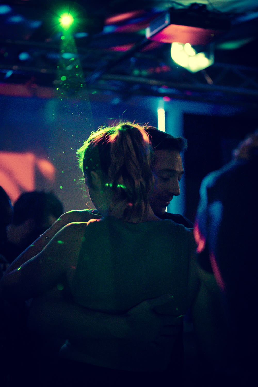 a man and a woman dancing at a party