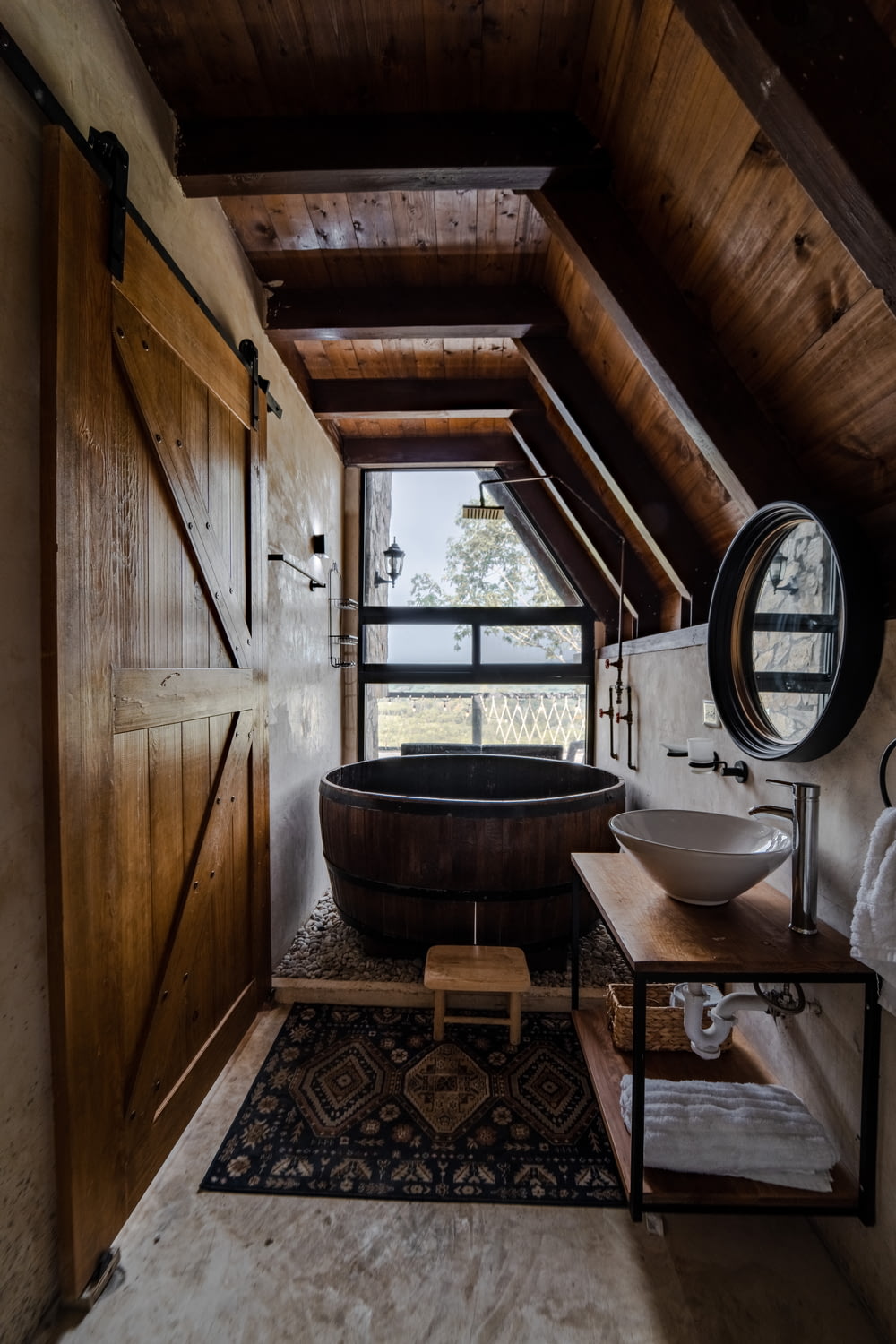 a bathroom with a tub and a sink in it