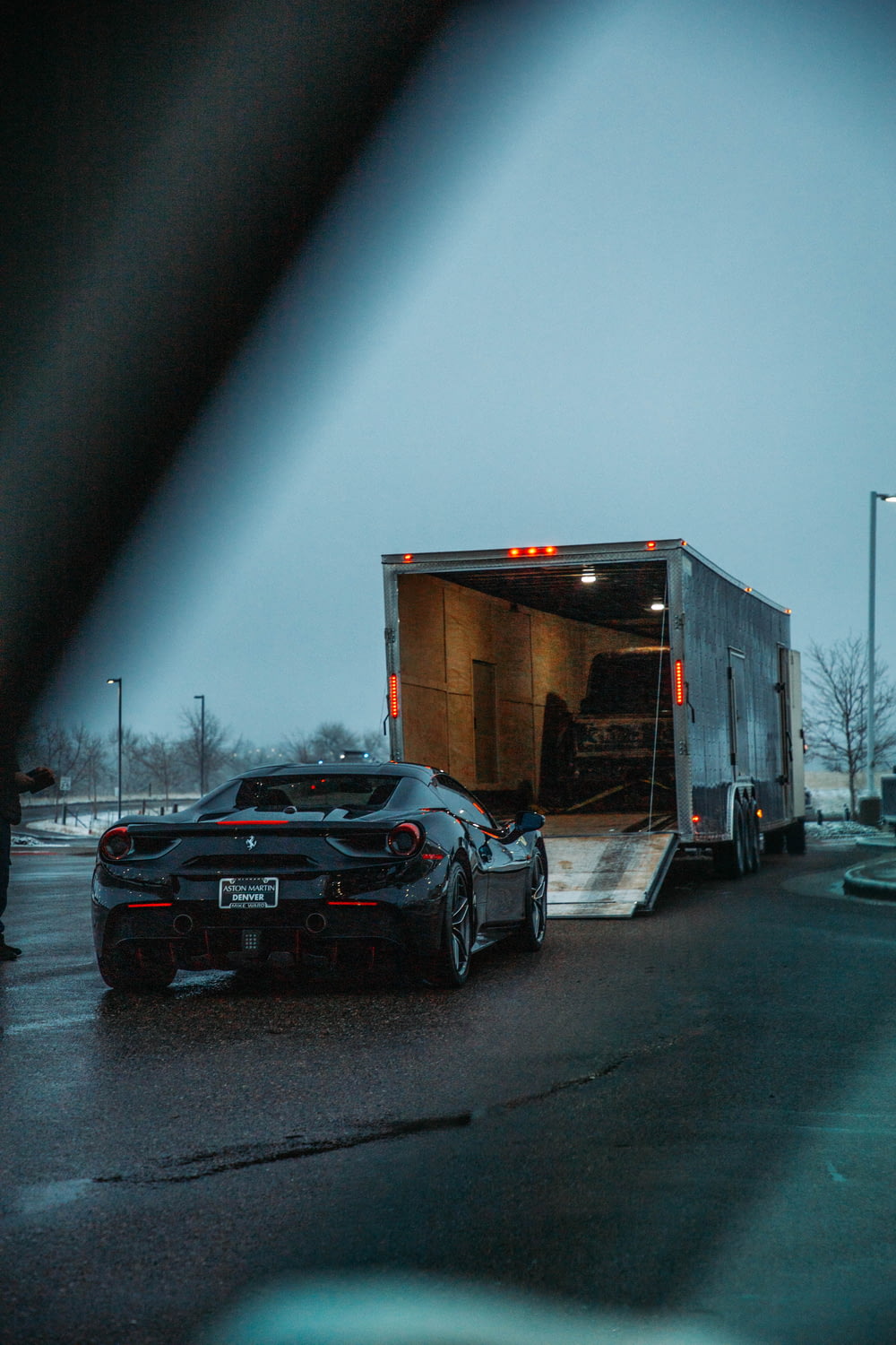a car is being loaded onto a trailer