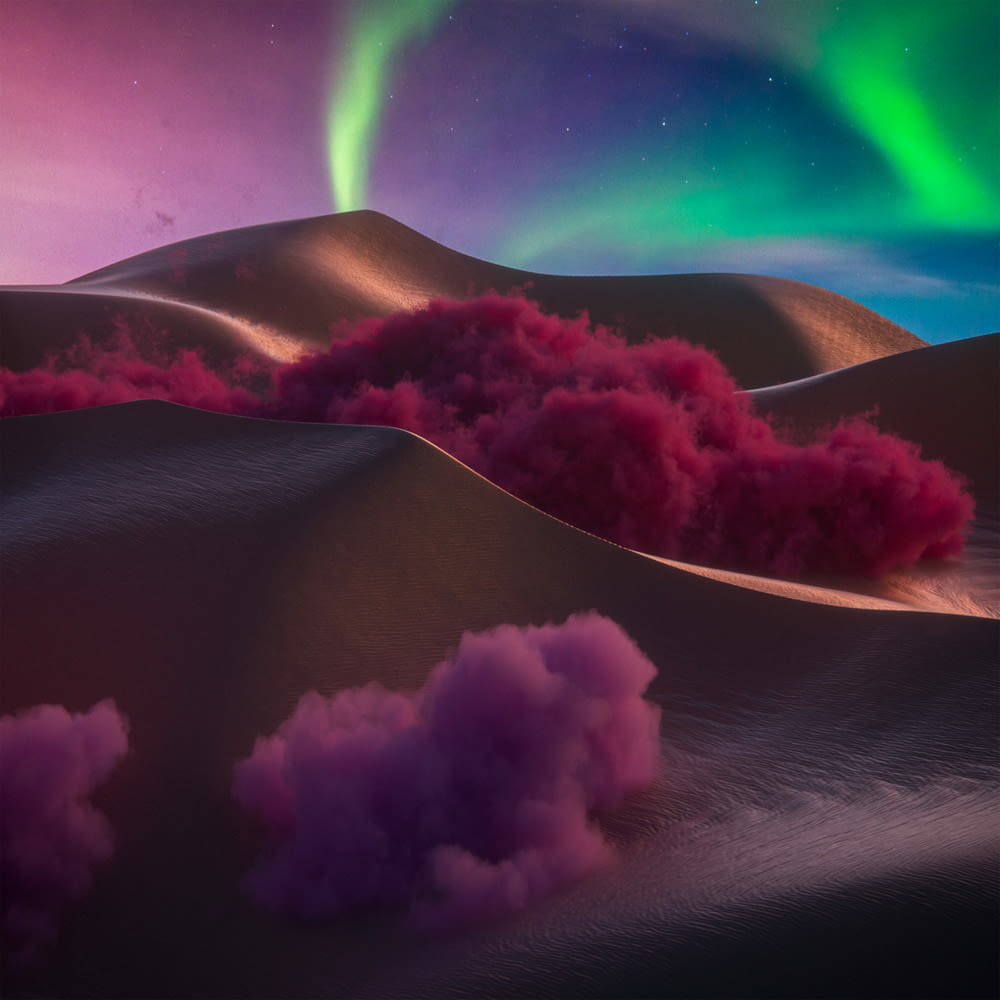 an aurora bore over a desert with pink smoke coming out of it