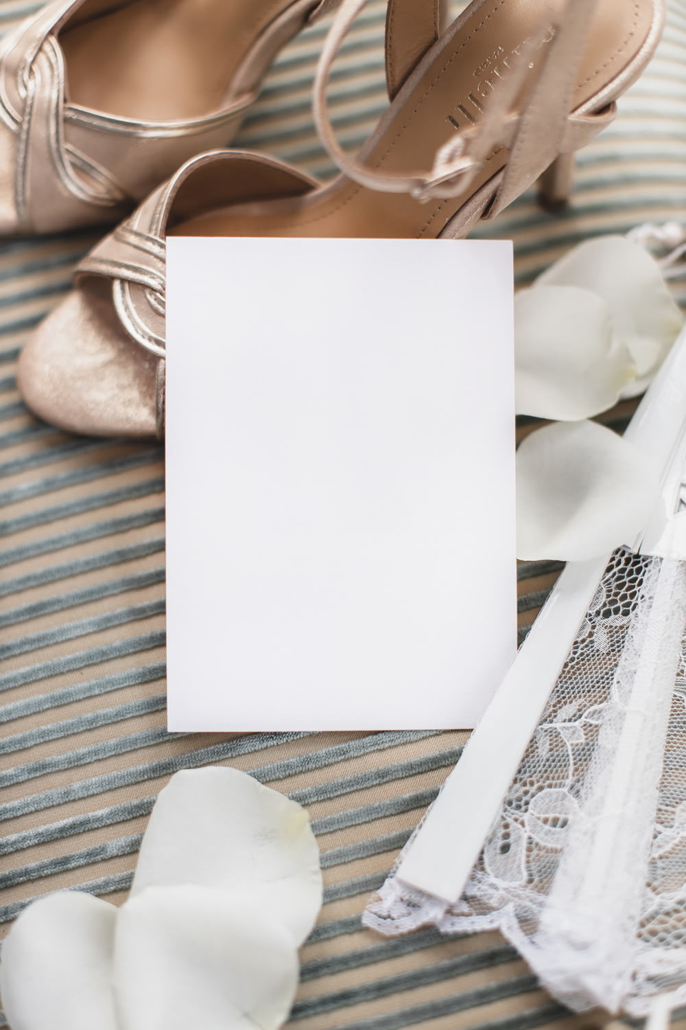 a pair of shoes and a card on a table